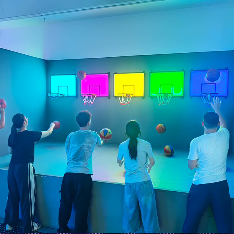 Players competing in the color-reactive Hoops room